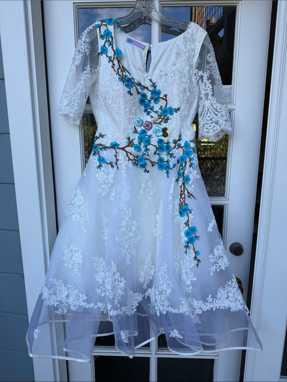 White Lace Wedding Dress with Blue Floral Appliqué